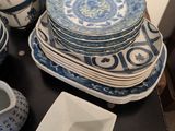 a lot of plates and cups on the table