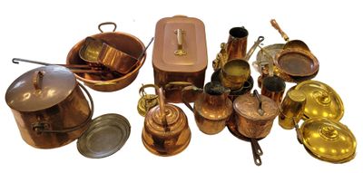many different types of copper pots and pans on the table