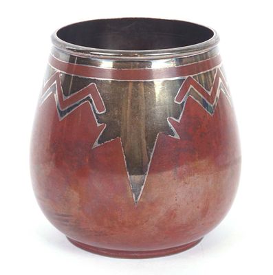 a vase with a design on it on a white surface
