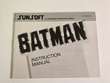 batman instruction manual on a white surface with a black and white background