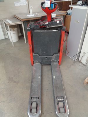 a fork lifter that is sitting in the garage