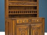an old wooden china cabinet with two doors and a shelf