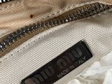 the inside of a white bag with a zipper on it