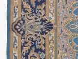 an image of a blue and yellow rug with a floral design on it