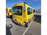 a yellow bus that is parked in a parking lot
