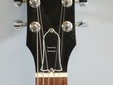 a close up of a guitar with a fretset on it