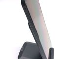 a cell phone that is sitting on a stand