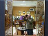 a man taking a picture of himself in a mirror