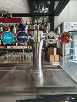 a beer tap on the counter in a bar
