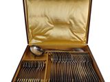 a wooden box with silverware in it on a white background