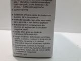 a bottle of liquid that is sitting on a table