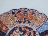 an image of a decorative plate with flowers and birds on it