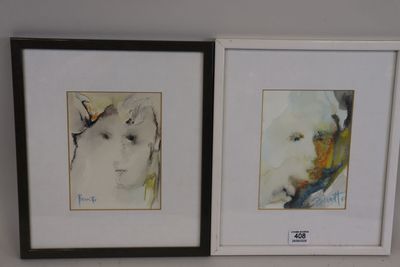 two framed pictures of a woman ' s face on the wall