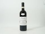 a bottle of wine that is sitting on a table