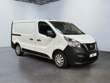 the white van is parked in a large room with a gray floor