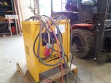 a forklift with a hose attached to it in a warehouse
