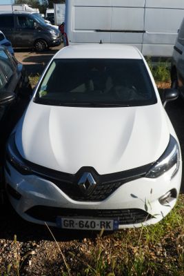 a white car that is parked next to a white truck