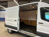 a white van with its doors open in a garage