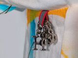 a close up of a person ' s hand holding a small metal object