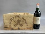 a wooden crate with a bottle of wine next to it