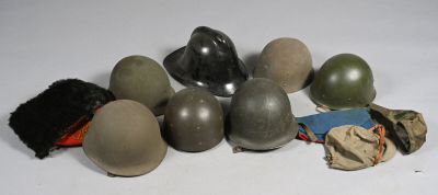 a lot of helmets that are sitting on a table