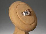 a ring sitting on top of a stand with a ring in it
