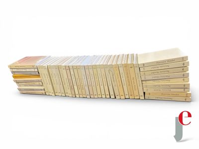 a lot of books stacked on top of each other