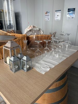 a table with wine glasses and wine glasses on it