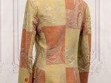 an orange and yellow jacket on a mannequin mannequin mannequin mannequin mannequin mannequin mannequin mannequin mann
