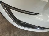 a close up of a car ' s front bumper