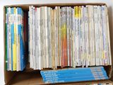 a box full of books sitting on a table