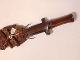 a wooden handle with a rope wrapped around it