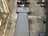 a row of exercise equipment in a gym room