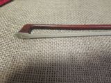 a small wooden handle on the back of a chair
