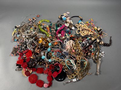 a pile of assorted jewelry sitting on a table