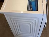 a washing machine and a dryer sitting on the floor