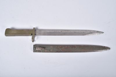 two knives that are laying side by side on a white surface