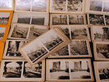many old black and white photos on the table