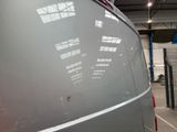 an image of a van in a garage with a lot of windows