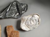 three different types of rocks on a table with a heart shaped rock