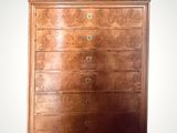 an image of a wooden chest of drawers on a white background