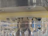 a close up of a machine that has a bunch of glasses in it