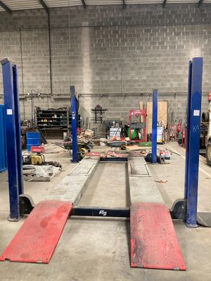 a picture of a garage with a lot of tools on the floor