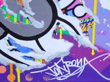 a picture of a painting on a wall that has been spray painted