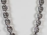 a close up of a necklace on a mannequin display