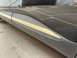 an image of a car with a yellow stripe on the side of it