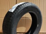 tire on the floor in front of a cardboard box and a cardboard box