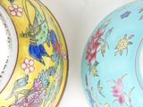two plates that are sitting side by side on the wall