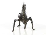 sculpture of a horse standing on its hind legs on a white surface