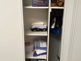 a closet with a lot of items in it